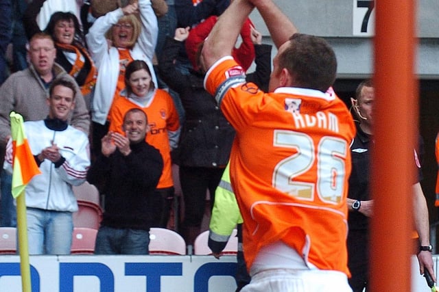 Charlie Adam celebrates with the jubilant Blackpool fans
