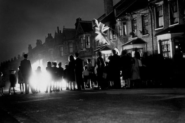 After years of blackouts, many people celebrated with bonfires. Former Wakefield Mayor Norman Hazell said he remembered being invited to help toss a tailor's doll dressed as Hitler into the flames.