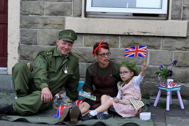 Michael Ashmore and his family enjoy a picnic outside their home in Adlington