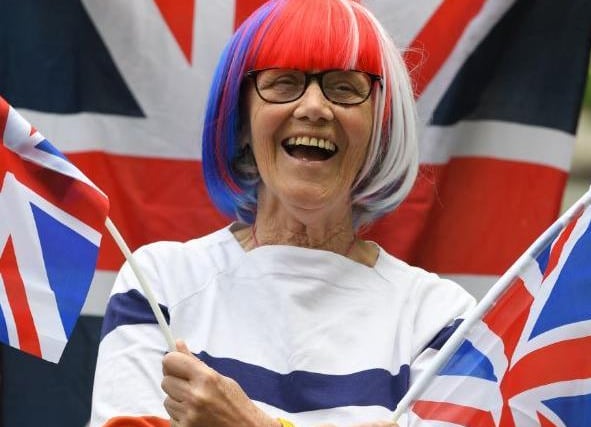 Proud Briton Mary Heaton celebrates VE Day in a sea of red, white and blue during a street party in Rawsthorne Road, Penwortham