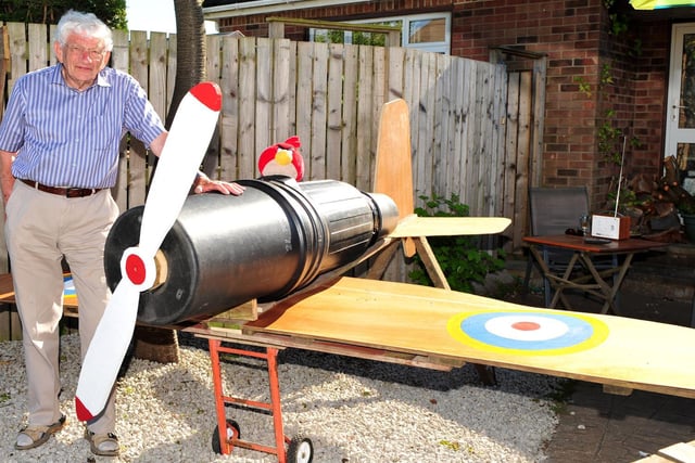 Peter Wilson is pictured with his WWII plane in his garden at the Beckwith Crescent street party.