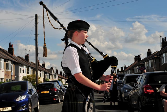 Pictured is 14-year-old Lucy Hall from Harrogate playing the bagpipes at the Beech Road street party.