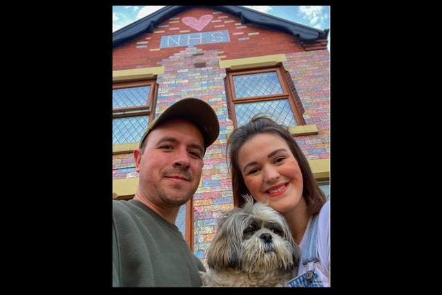 Charlie and Amelia Blanch from Penwortham, with dog Mowgli, the couple have decorated the front of their house in Penwortham in rainbow chalk colours, to show their love for the NHS