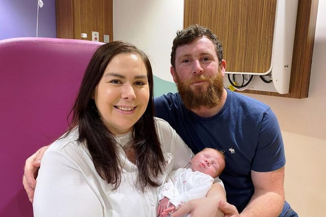 Kathrine Dawson, 36, who spent eight days on a ventilator battling for her life, and little Ruby, who was born while she was in hospital. They are pictured with new dad Stuart.