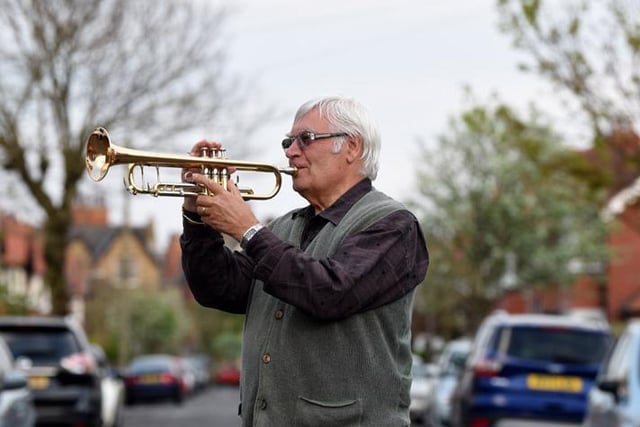 Musician Terry Reaney, from St Annes, plays trumpet on his street during the 8pm clap for NHS