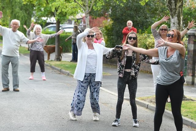 The Penwortham residents take to their street every day to sing Neil Diamonds Sweet Caroline together!