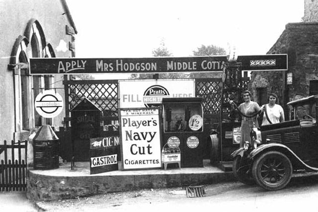 1920s - A petrol station in the village of Newton