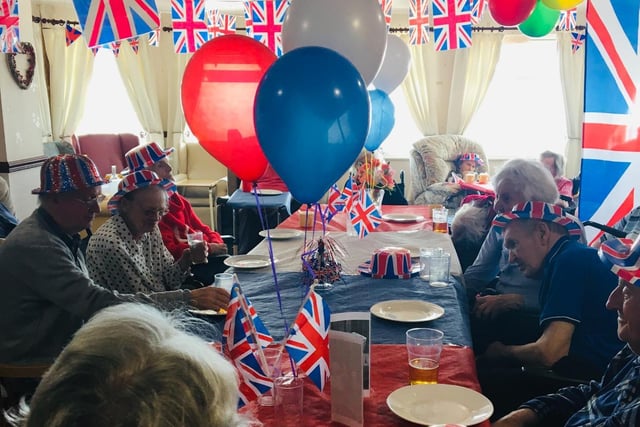 Residents at The Sands care home enjoy a VE Day party.