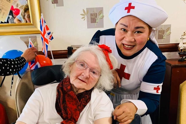 A member of staff at The Sands care home in Morecambe dressed as a 1940s nurse, with one of the residents.