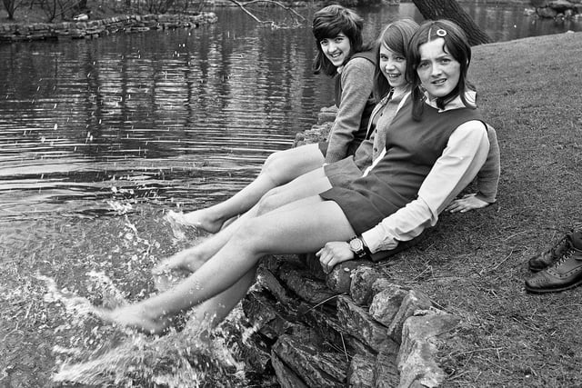Young schoolgirls Lorraine Ridyard, Christine Woods and Denise Sinclair splashing in the duck pond on a mild Spring day in Mesnes Park on Monday 20th of March 1972.