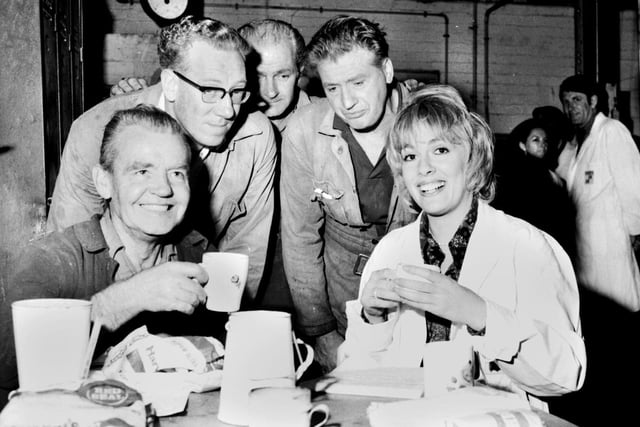 Esther Rantzen, best known as presenter of television's "Thats Life", enjoys a cuppa with workers during a visit to the Croda glue works factory at Appley Bridge in 1971 as part of tv programme "Braden's Week".