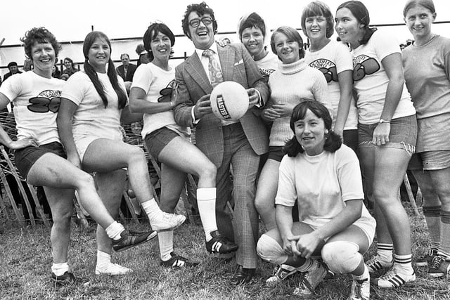 Television comedian Frank Carson with one of the teams competing in an "It's a Knockout" tournament on Bank Holiday Monday 29th of August 1977.