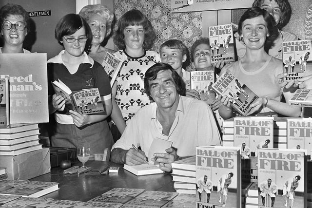 Legendary England and Yorkshire fast bowler Fred Trueman signing copies of his autobiography "Ball of Fire" in Wigan Cricket Club at Bull Hey on Tuesday 29th of June 1976.