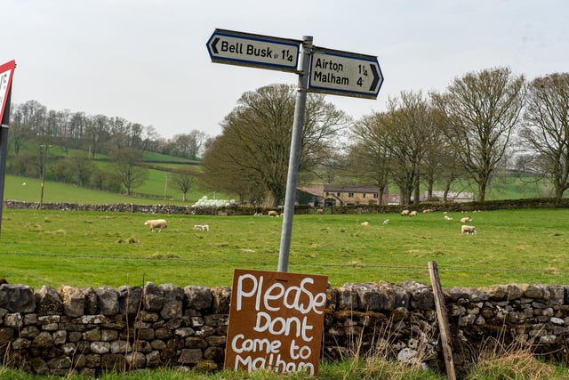 A sign saying 'Please don't come to Malham' on Good Friday during the coronavirus lockdown which saw the usual bank holiday hotspts deserted.