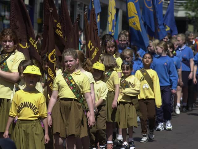 Members of the Rainbows, Brownies, Guides, Rangers and Young Leaders taking part in a march towards a special service  where they re-dedicated themselves to Queen and country, held at the Guild Hall in Preston