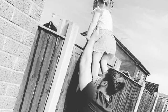 Stacey Catherine shared this photo of her two-year-old grandaughter with her daddy on their daily walk, peering over the fence to say hello."This broke my heart when I realised my daughter had taken this photo from the other side of the fence. Love her to bits."