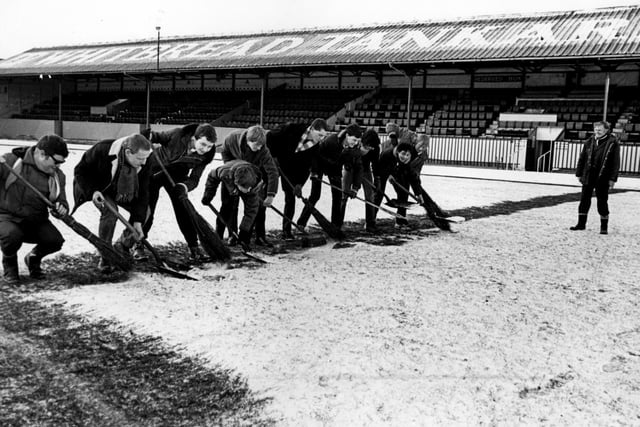 Volunteers clear snow from the Blackpool FC pitch in 1982