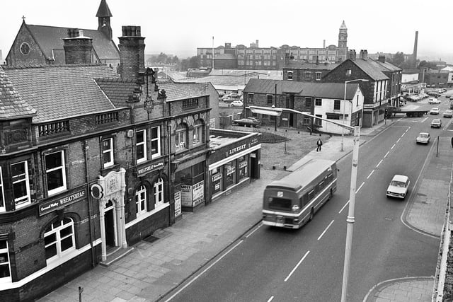 A view of Wallgate, Wigan, from the railway bridge with the Wheatsheaf pub prominent and St. Joseph's RC Church and Trencherfield Mill in the background in October 1979.
