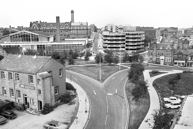 A view looking up Millgate, centre, with Darlington Street and Horse Shoe Hotel on the right and Unilec Electronics and Wigan International Pool on the left in 1976.