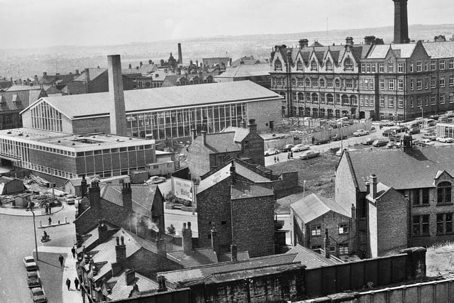 A view from Scholes railway bridge towards Wigan International Pool under construction in July 1966.  In the middle of the picture is the Bath Hotel on Millgate and right is the Powell Museum on Station Road.