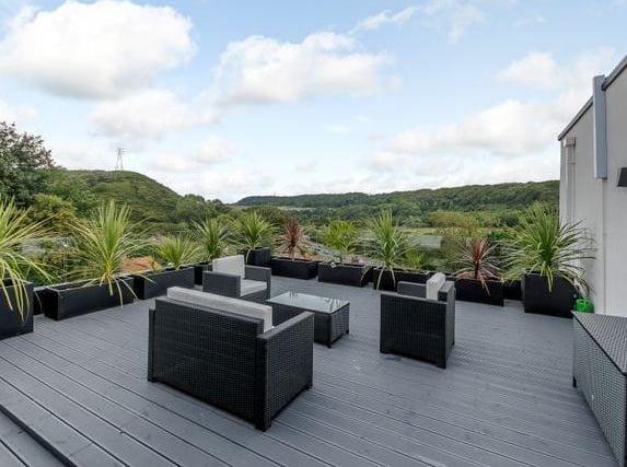This stunning four bedroom property, currently for sale with Fine & Country, offers breath-taking views of Oliver's Mount and beyond. This property has a gym, large kitchen and roof balcony.