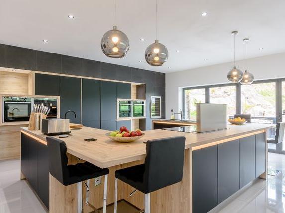 This stunning four bedroom property, currently for sale with Fine & Country, offers breath-taking views of Oliver's Mount and beyond. This property has a gym, large kitchen and roof balcony.