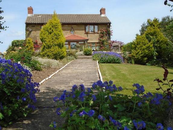 This three bedroom detached farm house, for sale with Hunters, is set within two acres of south facing land. This property also includes a two bedroom detached cottage with garage and excellent potential for holiday letting.