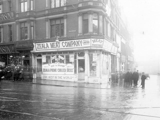 Duncan Street on Briggate. Owen & Robinson Ltd, jewellers to left, then Zeala Meat Company - butchers. Call Lane to right. Groups of men both on Duncan Street and in front of the Zeala Meat Company. Pictued in February 1908.