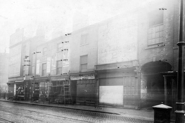 North side of Duncan Street, showing Bean's butchers, Longley tobacconist, Wragg Pork butchers, Wilkinson Milliner and the entrance to Mercury Office yard.