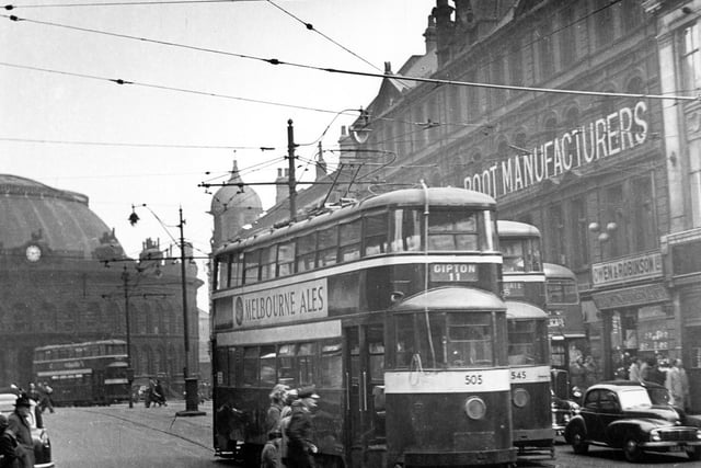 Duncan Street looking towards Corn Exchange showing Tram No 505 and on route 11 to Gipton and tram 545 travelling route 15 to Whingate. Owen and Robinson Jewellers can be seen on right.