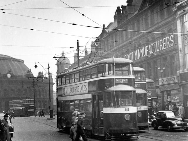 Duncan Street in April 1955 looking towards Corn Exchange showing Tram No 505 and on route 11 to Gipton and tram 545 travelling route 15 to Whingate. Owen and Robinson Jewellers can be seen on right.