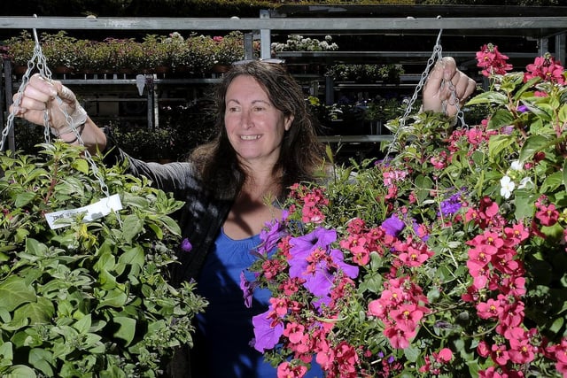 Burniston Garden Centre co-owner Deborah Collins tending to the plants