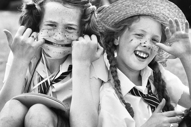 Cheeky schoolgirls Kelly Hill and Michelle Edwards at Poolstock Carnival on Sunday 21st of May 1989.