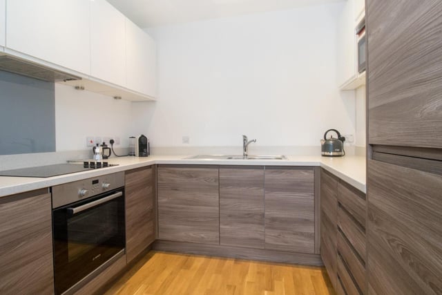Te kitchen area is fitted with a range of contemporary wood effect cabinetry with integrated oven, hob, extractor oven, washing machine/dryer, dishwasher and fridge/freezer.