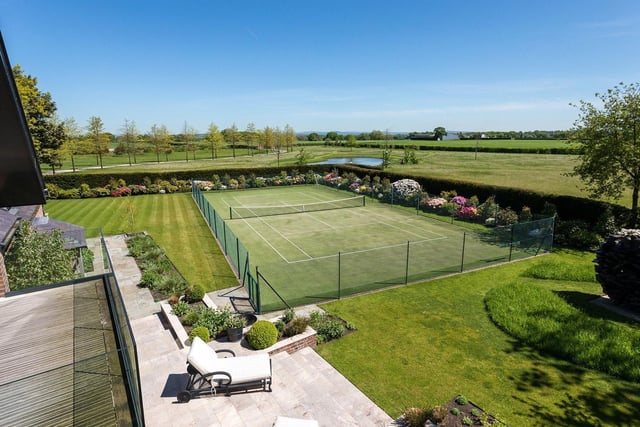 Outside there is an Astroturf tennis court and a comprehensive range of domestic outbuildings include extensive garaging, a tractor store, a gardeners room and storage.