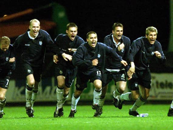 The PNE squad run to celebrate after their play-off semi-final penalty shoot-out victory over Birmingham at Deepdale on May 17, 2001