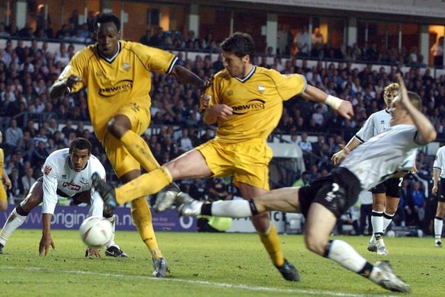 PNE's Claude Davis and Brian O'Neil double up to clear a Derby attack