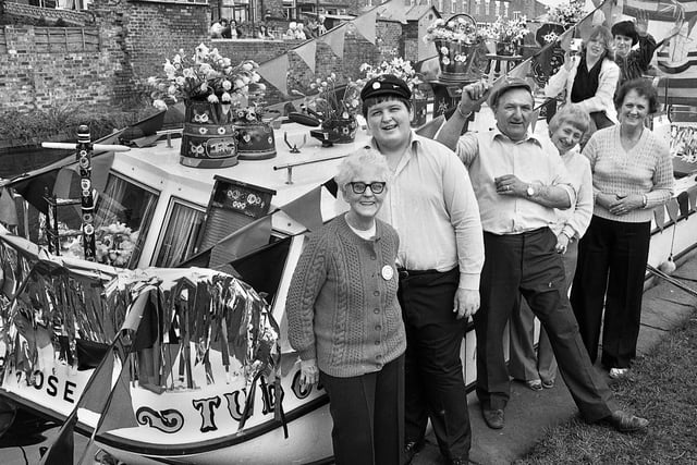 A family from Skelmersdale with one the best decorated boat prizes for their craft, the Tudor Rose, at the Appley Bridge Boat Rally on Saturday 5th of April 1980.
The boat rally was a popular event for many years and organised by the Douglas Valley Cruising Club over the Easter weekend.