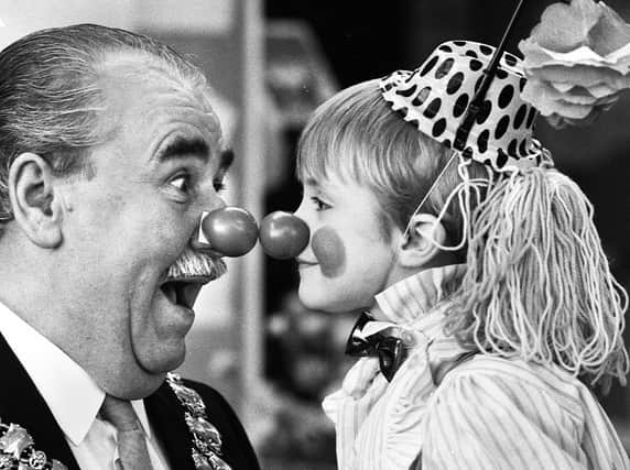 Nice to nose you.....Wigan mayor Councillor Jimmy Jones comes face to face with five-year-old Gary Edwards at Wood Fold Primary School, Standish, for Red Nose Day in aid of Comic Relief on Friday 5th of February 1988.