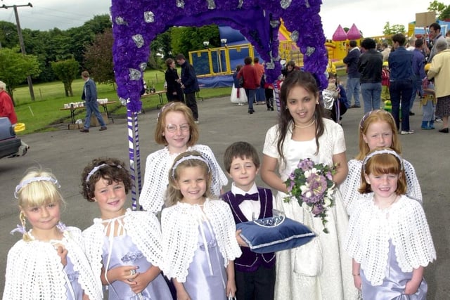 From left, Lucy Stewart, Holly Hands, Gemma Harrison, Alice Pell, Frank Catterall, Gala Queen Rebecca Grogan and Katie and Amy Montgomery at St Michael's Gala, near Preston in 2001