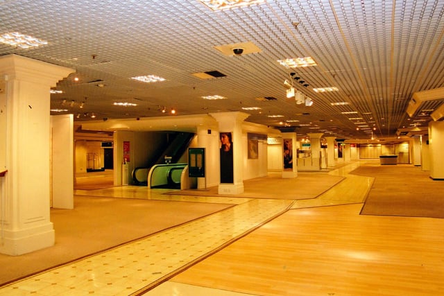 The second floor, with the escalators in the centre. This floor, which had been occupied by the ladieswear and lingerie departments, as well as a restaurant, is now virtually empty.