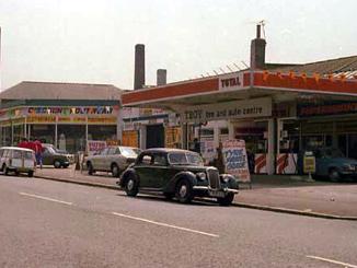 Harehills Lane. Towards the left is Discount Footwear, followed to the right by a Total petrol filling station.