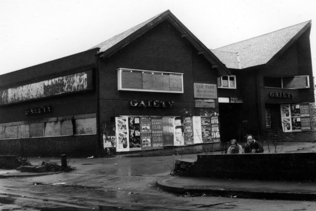 The Gaiety Public House with boarded windows and the remnants of old advertising posters which date the photograph to circa 1996.
