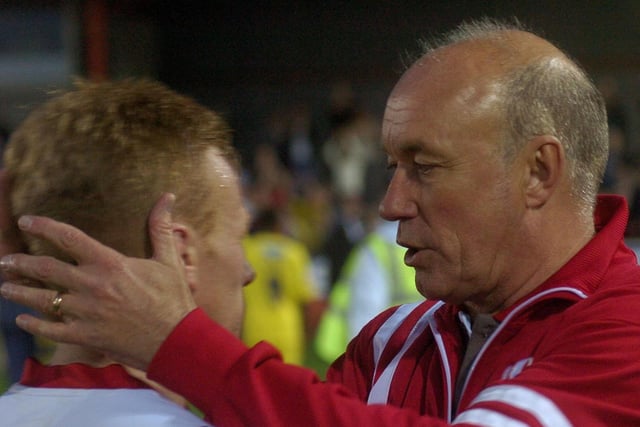Sammy McIlroy consoles Mark Duffy at the final whistle