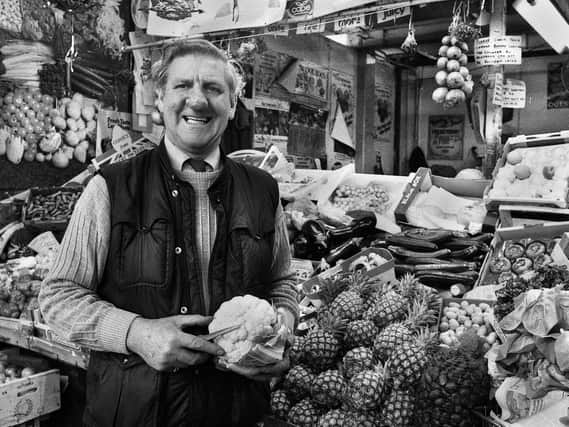 Ken Hall on his fruit and vegetable stall in the old Wigan market hall in December 1987.