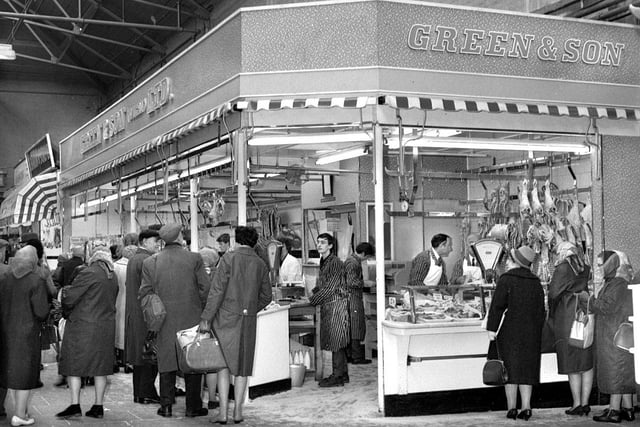 The busy Green & Son butchers stall in the old Wigan Market Hall in 1966.