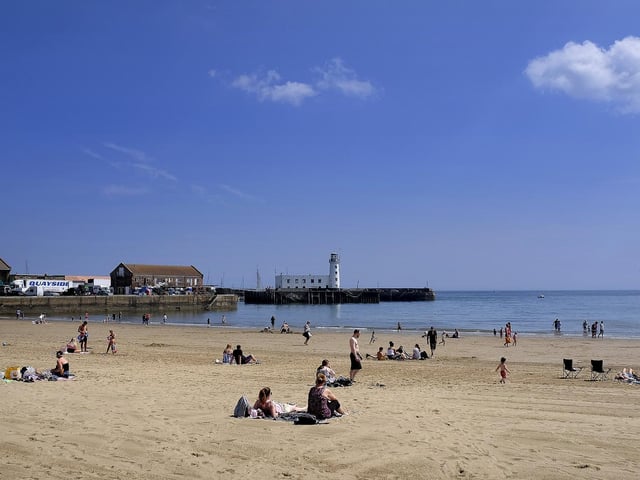 People return to the beach after slight easing of lockdown restrictions.