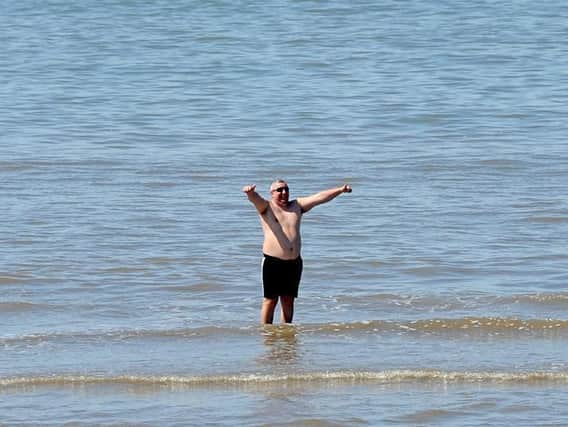 Sunseekers visit the beach in Blackpool as lockdown restrictions are relaxed during the coronavirus pandemic