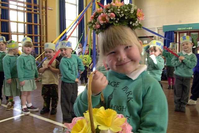 Grange Park Infants May Queen Katie Turner who was four and children from the school dance round the May Pole