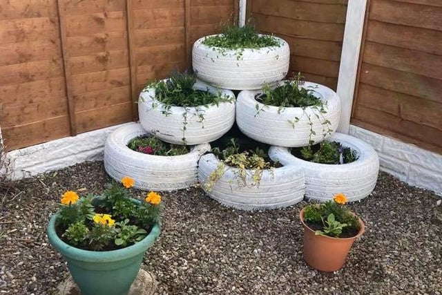 Denise Bradley recycled old car tyres to make planters for her garden.